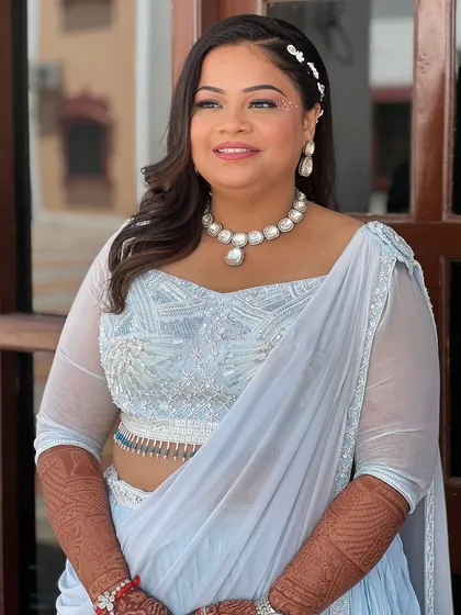 A smiling portrait of the bride, looking fresh and ready for some fun by the pool.