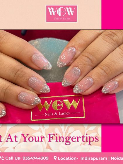 A chic and simple way to wear glitter. This design features a sheer nude base with a delicate silver glitter ombré on short, rounded nails.