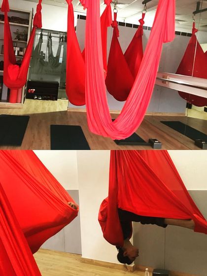 The aerial plow pose is an intense stretch for the entire back side of the body. The hammock provides support and helps to decompress the spine during this deep forward bend.