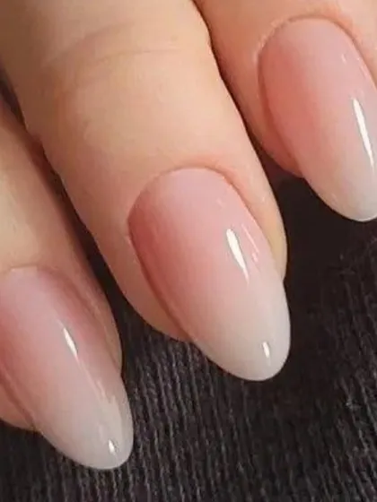 A close-up of the natural ombre nails I hand-blended for Deepika Padukone. I used a milky white and a soft nude to create this seamless, sophisticated finish that exudes luxury.