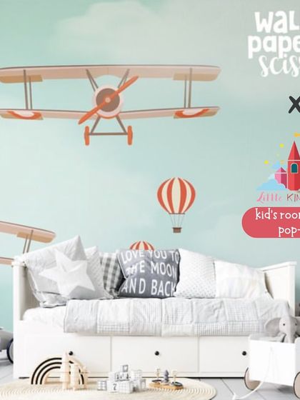 This beautiful room setup features airplane-themed wallpaper from Wall Paper Scissor. Their made-to-measure wallpapers and reusable stickers can transform any room into a world of adventure.