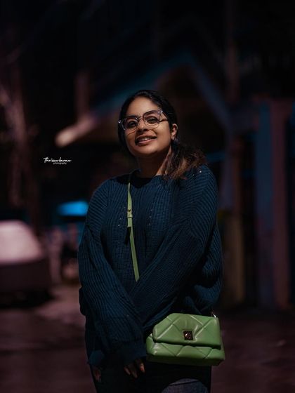 A night portrait on a Bangalore street, using the ambient city lights to create a cool, atmospheric mood. I enjoy shooting at night to capture a different side of the city.