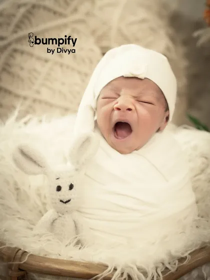 A tiny yawn can be the most precious memory. My newborn sessions are all about capturing these fleeting, natural moments, showing the pure innocence of your baby in a simple, beautiful way.