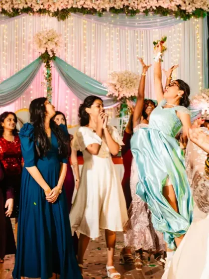 The bouquet toss! A moment of high-flying action and excitement as one of the bridesmaids makes an athletic catch.