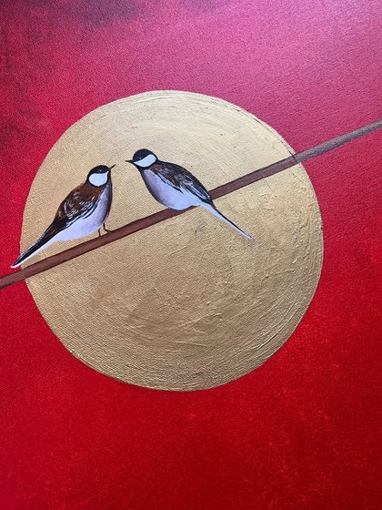 A beautiful painting of two birds perched on a wire against a golden moon. The vibrant red background makes this a very striking and romantic piece.