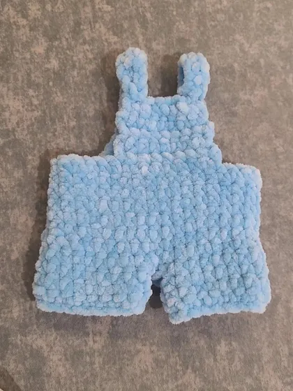 The tiny, handmade overalls for the Fluffy bunny plushie, crocheted with soft blue velvet yarn. Adding little outfits is one of my favorite parts of customization.