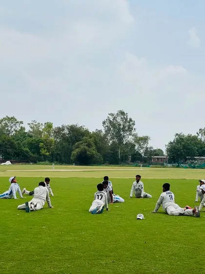 Players relaxing during a stretching session. Flexibility is just as important as strength in cricket.