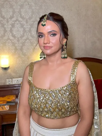 A messy braid with tassels is a fantastic choice for a mehendi function. This look was for the bride, but it's a perfect inspiration for a bridesmaid who wants a fun and festive style.