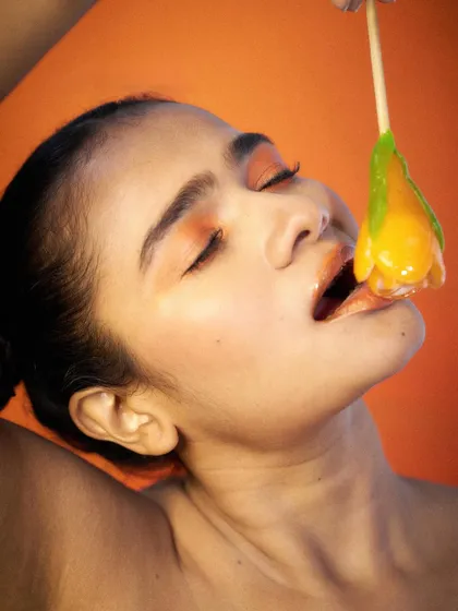 A close-up shot focusing on the interaction with the product. This type of image is effective for highlighting texture, color, and the sensory experience of a product.