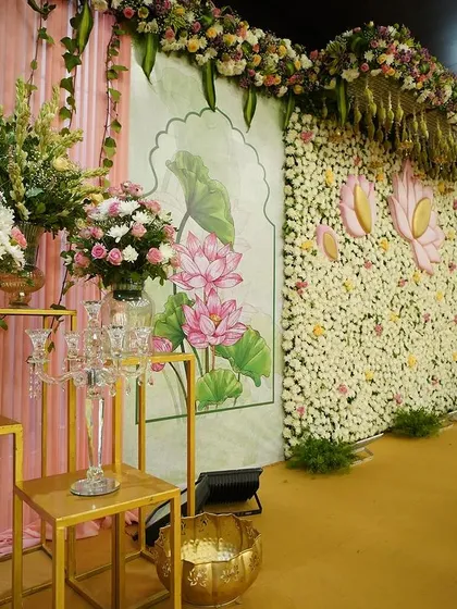 This grand floral backdrop was the centerpiece for a beautiful naming ceremony. We created a wall of fresh white chrysanthemums accented with hand-painted lotus motifs and lush floral arrangements to bring our client's vision of traditional elegance to life.