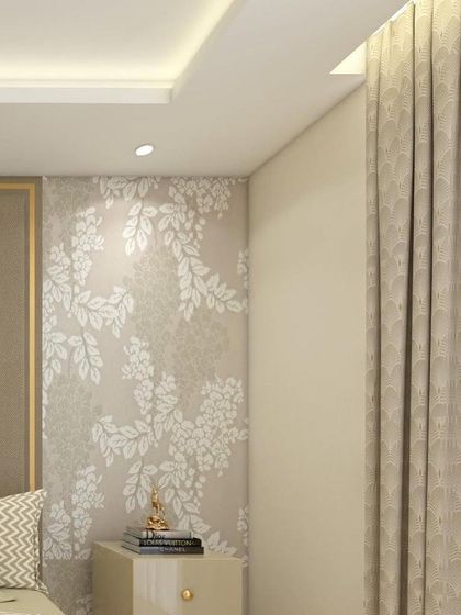 A detail shot of a master bedroom, showing a floral wallpapered accent wall next to the bed. A small Buddha statue on the nightstand adds a touch of serenity to the elegant space.