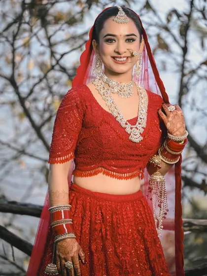 The quintessential happy bride. Her bright, open smile and sparkling diamond jewelry make this a joyful and classic bridal portrait.