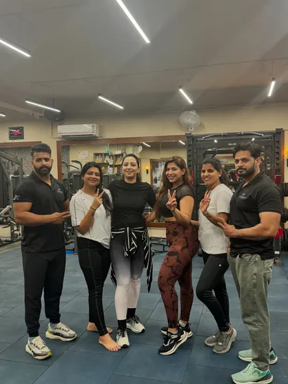 Posing with some of my dedicated clients and fellow trainers. We are a team committed to helping you transform your life.