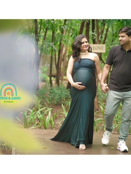 A walk to remember. This candid shot captures the couple walking hand-in-hand, sharing a happy glance, perfectly illustrating their journey together into parenthood.