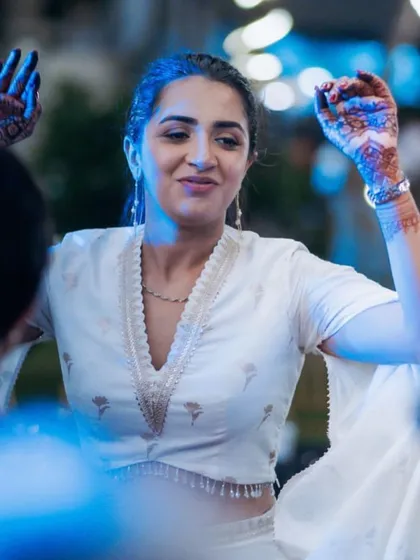 The bride enjoying the music and dancing with her friends at the Sangeet. Our goal is to create a space where everyone, especially the couple, can let loose and have fun.