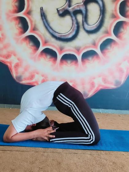 Here I am in an advanced variation of Ustrasana, or Camel Pose. Poses like this demonstrate how yoga therapy can help achieve deep flexibility and relieve pain, leading to a healthier, happier life.