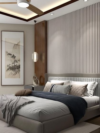 This bedroom is a sanctuary of balance and comfort. We used a combination of vertical wood paneling, soft textiles, and curated art to create a modern space that feels both elegant and restful.