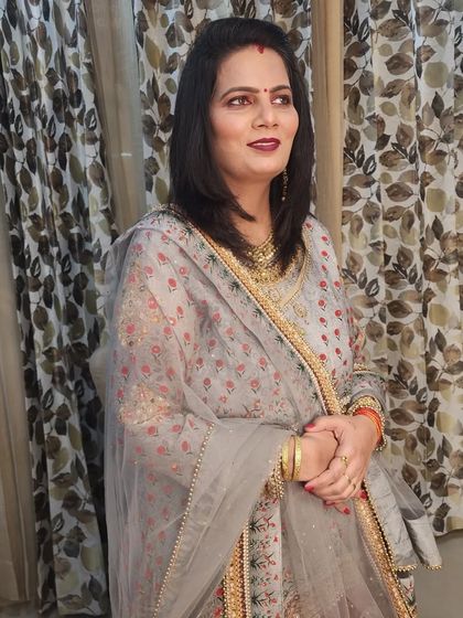 The final look of the client, looking elegant and ready for the family event.