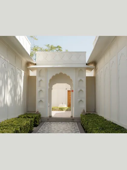 The beauty of negative space. This wide shot of the venue's architecture shows how I use the location itself as a key design element, creating clean, beautiful pathways that lead to the heart of the celebration.