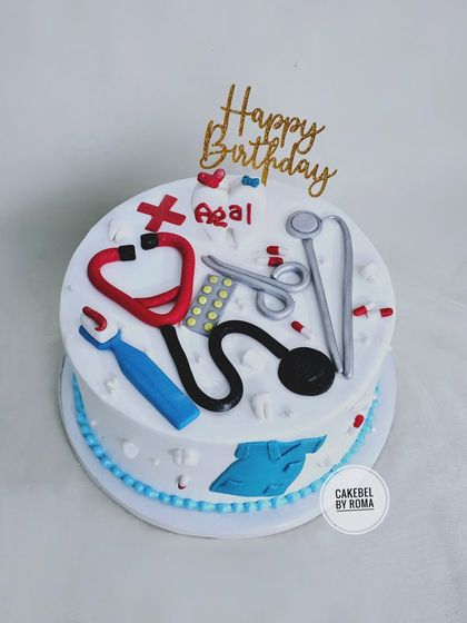 A doctor-themed cake perfect for celebrating a medical professional. The cake is decorated with a stethoscope, scrubs, pills, and other essential medical tools, all made from fondant.