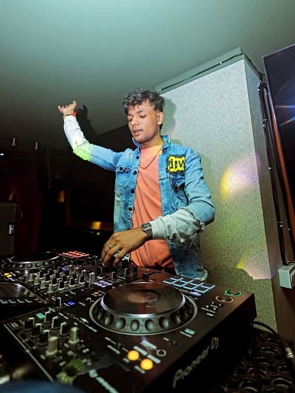 No competition, just a curated vibe. A shot of me in action, mixing tracks for a happy weekend crowd.