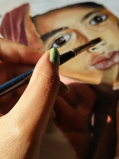 A quiet moment in the studio, with sunlight catching the canvas as I work. For me, the act of painting is a form of therapy and a peaceful escape.