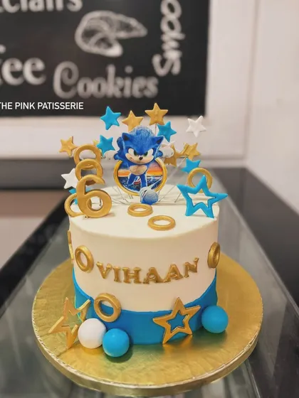 A dynamic Sonic the Hedgehog cake for a 6th birthday celebration. We included gold rings and stars to bring the high-speed energy of the game to this fun design.