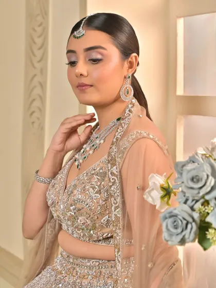 Another angle of this gorgeous sangeet look. The makeup is designed to look stunning from every angle, with a focus on radiant skin and soft, romantic details.