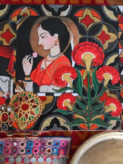 A top-down detail of the lid, showcasing a beautiful portrait inspired by Indian miniature painting. The surrounding floral and geometric patterns add to its romantic and nostalgic feel.
