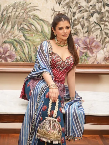 A closer look at this intricately designed potli, featuring pearl tassels and detailed embroidery. It’s a piece of art that you can carry.