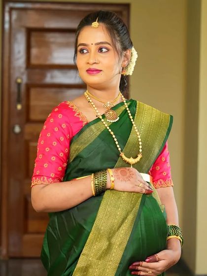 A candid shot of Namratha, looking beautiful and serene during her baby shower function.