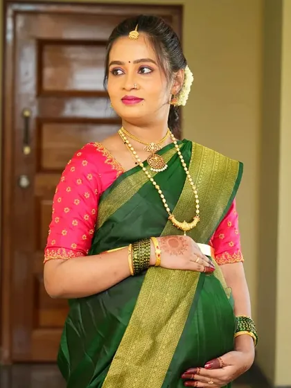 A candid shot of Namratha, looking beautiful and serene during her baby shower function.