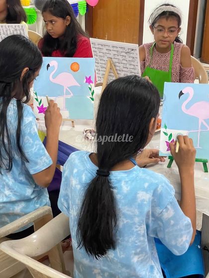 A group of young artists deeply focused on their flamingo canvas paintings. I love providing a space where kids can concentrate and let their creativity flow.