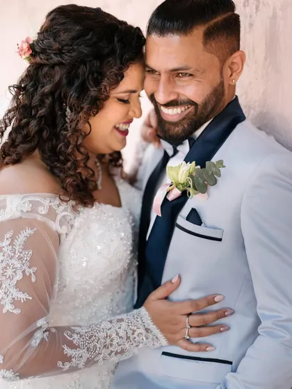 An intimate and happy moment between a bride and groom. I focus on capturing these close-up interactions that show the deep bond and affection between a couple.