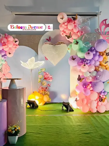 The full setup for the pastel butterfly garden party, including the cake stands and props.