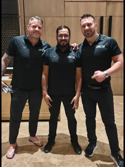 Another shot of our coaches with the international MFN team, highlighting our global connections.