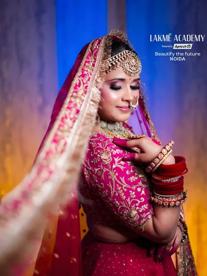 The elegance of a bridal veil shot. This image highlights the soft, diffused light and the bride's glowing skin, demonstrating advanced techniques in bridal styling and photography.