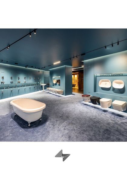 The entire showroom floor is designed as a cohesive experience, where customers can move from broad views to detailed product interactions effortlessly.