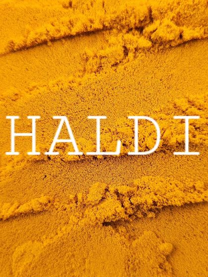 The word 'Haldi' over a bed of turmeric. It's more than a spice; it's a part of our identity.