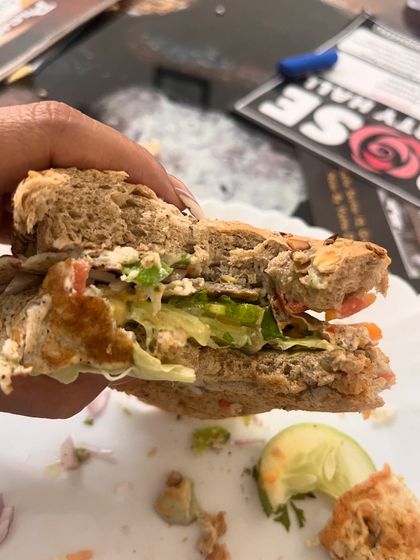 Taking a bite of my delicious and healthy Sunday sandwich. It's proof that you don't have to give up your favorite foods, just make healthier versions of them.