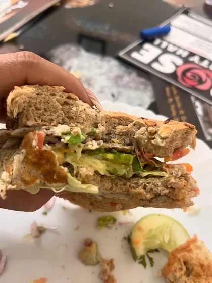 This is my idea of a perfect Sunday meal. A multigrain sandwich filled with a fluffy omelette, fresh lettuce, cucumber, tomato, and onion. It proves that a balanced breakfast is the first step to a balanced life.
