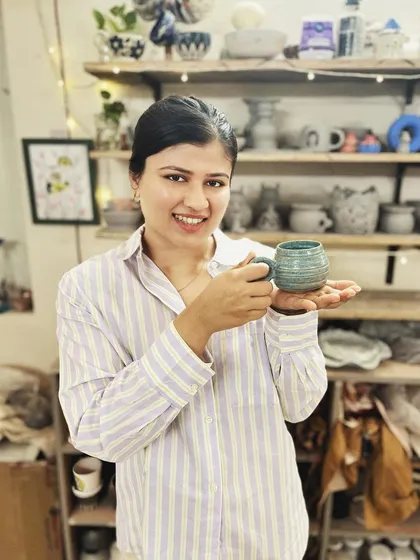 This student created a wonderful variety of forms and textures in her beginner's course, from a marbled Nerikomi bowl to a textured mug with a unique handle.