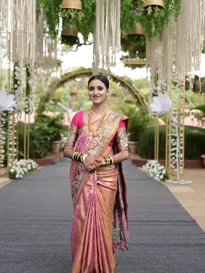 A beautiful Maharashtrian bride ready for her reception. I draped this Kanjeevaram Tissue saree in a Nivi style with fluffy center pleats to create a look of pure elegance and grace for her celebration.