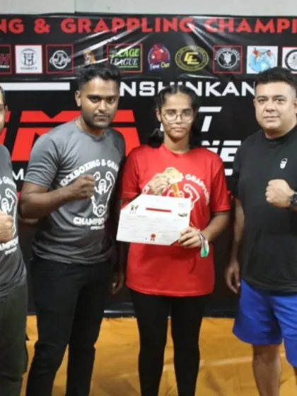 A student receiving her certificate at our in-house Kickboxing & Grappling Championship. We believe in giving our students a platform to test their skills and gain valuable competition experience.