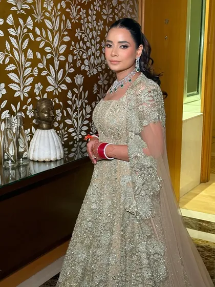 My signature understated glam for a bride on her reception day. In a gorgeous gold-encrusted Mishru outfit, she was a vision of elegance for her big day.
