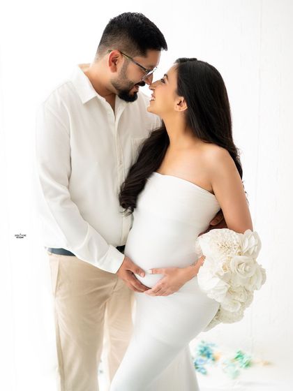 A classic nose-to-nose pose that is so full of love and anticipation. The all-white theme is pure and timeless.