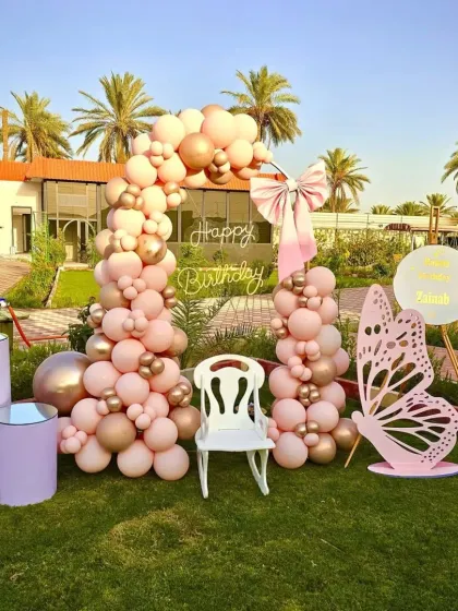 This angle includes the light-up number '1' and themed pedestals, adding more dimension to the butterfly party decor.