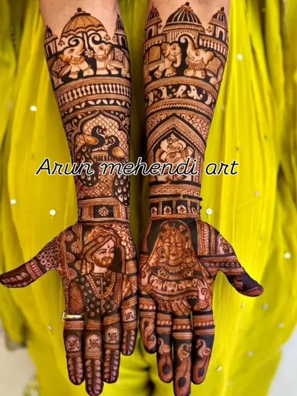 This intricate bridal mehendi features detailed portraits of the bride and groom, surrounded by auspicious elephants and peacocks, symbolizing a blessed union.