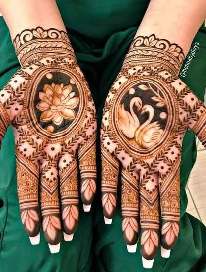 A creative design with a lotus on one palm and a pair of swans on the other, symbolizing purity and love. The shading adds a beautiful, soft dimension.