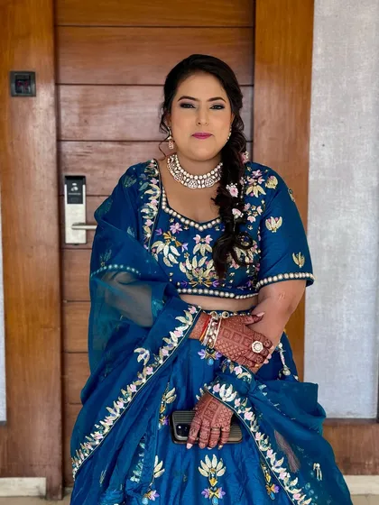 Royal blue elegance. This soft glam look with fluttery lashes and a mauve pout brings out her grace.